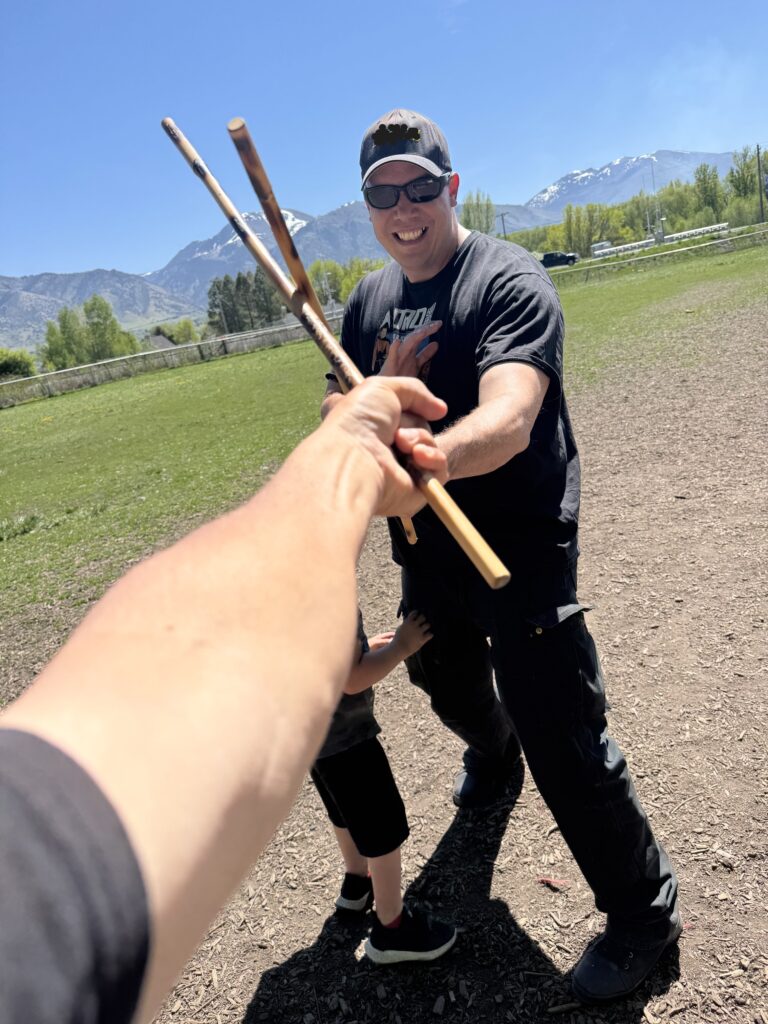 Tuhon Brandon at the dog park training with Grand Tuhon Nate.